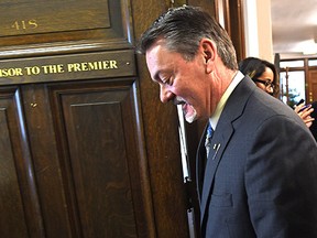 MLA Doug Horner walks back to his office after announcing he is leaving politics at the end of January during a news conference at the Alberta Legislature in Edmonton, January 22, 2015.