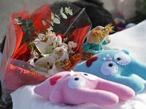 A small memorial has begun in front of the home in the north side at 180th Avenue and 83rd Street where seven bodies were discovered.