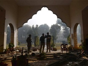 Pakistani policemen conduct an investigation at the site of the militants attack at the army-run school in Peshawar on December 18, 2014. Pakistan began three days of mourning on December 17 for the 132 schoolchildren and nine staff killed by the Taliban in the country's deadliest ever terror attack as the world united in a chorus of revulsion.