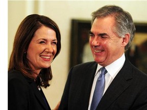 Danielle Smith and Premier Jim Prentice speak about Smith and eight other Wildrose caucus members uniting with the Progressive Conservative caucus at Government House in Edmonton on Dec. 17, 2014.