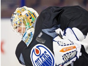 Oilers goalie Ben Scrivens wears his new mask created by artist Marc Munan during a practice on Jan. 9, 2015. The mask will be auctioned off to raise funds for the Schizophrenia Society of Alberta.