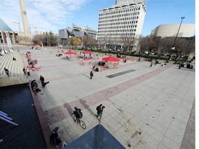 FILE - People enjoy summer-like weather in Churchill Square on Oct. 20, 2014.