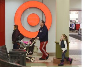 People walk past the Bonnie Doon Target store in Edmonton on Thursday Jan. 15, 2015. Target announced it will close all 133 Canadian stores, six of which are in the Edmonton area.