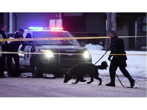 Police investigate the scene after a body was found at 120th Street and 25th Ave. in Edmonton on Jan. 21, 2015.