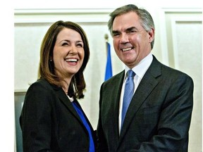 Alberta Premier Jim Prentice and former Wildrose Leader Danielle Smith speak to media.THE CANADIAN PRESS/Jason Franson