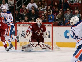 Devan Dubnyk stops a shot by Taylor Hall earlier this season.