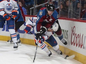 There was nothing over-the-top about Friday's tame affair, despite this attempt by Avalance captain Gabriel Landeskog to vault over Anton Lander of the Oilers.