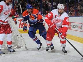 Benoit Pouliot of the Edmonton Oilers pursues Detroit's Henrik Zetterberg in the same part of the ice where Pouliot later took a game-changing penalty.