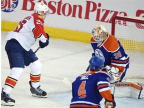 Sean Bergenheim of the Florida Panthers scores on Edmonton Oilers goalie Ben Scrivens during Sunday’s National Hockey League game at Rexall Place.