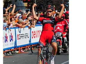 Switzerland’s Silvan Dillier celebrates winning Stage 2 in the Tour of Alberta professional cycling race as he crosses the finish line in Red Deer on Sept. 5, 2013.