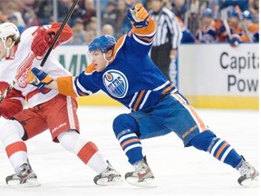 Taylor Hall of the Edmonton Oilers chases down Damien Brunner of the Detroit Red Wings at Rexall Place in Edmonton on Friday, March 15, 2013.