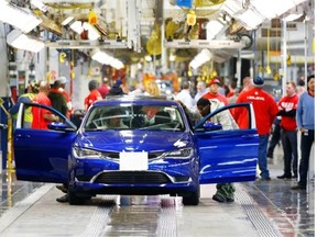 In this March 14, 2014 file photo, a 2015 Chrysler 200 automobile moves down the assembly line at the Sterling Heights Assembly Plant in Sterling Heights, Mich.