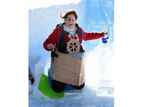 Tineke DeJong of the Old Strathcona Business Assc. zips down the giant ice slide at the kickoff for this years Ice On Whyte Festival, which has a pirate theme,  in Edmonton on Thursday Jan. 22, 2015.