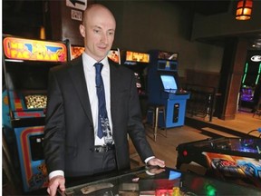 Winston Tuttle plays pinball at Denizen Hall in downtown Edmonton, where a pinball tournament will be held on Saturday