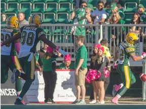 Edmonton Eskimos defensive end Willie Jefferson, left, and wide receiver Akeem Foster follow kick-returner Kendial Lawrence into the end zone after a kickoff-return touchdown to open the second half in Sunday’s Canadian Football League game against the Saskatchewan Roughriders at Mosaic Stadium in Regina.
Photograph by: Liam Richards, THE CANADIAN PRESS