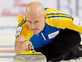 Alberta skip Kevin Koe delivers a rock during the Tim Hortons Brier Canadian men’s curling championship at Kamloops, B.C. on March 1, 2014.