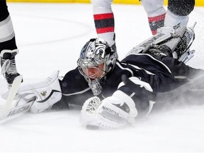 Los Angeles Kings goalie Martin Jones dives on the puck during NHL action against the New Jersey Devils on Jan. 14, 2015.