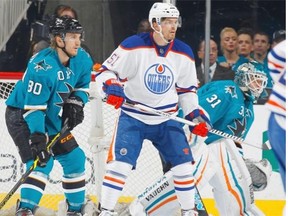 Antti Niemi #31 and Matt Tennyson #80 of the San Jose Sharks get in position for a shot on net against Anton Lander #51 of the Edmonton Oilers during an NHL game on February 2, 2015 at SAP Center in San Jose, Calif.