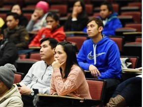 An audience listens to speakers during the Temporary Foreign Workers Support Coalition’s, event at the University of Alberta on Monday, Feb. 2, 2015.