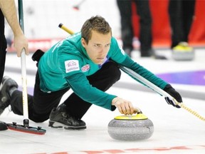 Brendan Bottcher of the Saville Centre throws a rock during the round-robin portion of the Boston Pizza Cup Alberta men’s curling championship at the Peace Memorial Multiplex in Wainwright in February 2015..