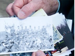 A Canadian veteran of the Korean War holds an image of his platoon prior to a memorial ceremony in 2013 in Gapyeong, Republic of Korea.