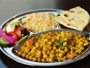 Chana masala at the Nosh Cafe includes a generous portion of curried chickpeas and pillowy naan for dipping.