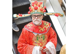 City councillor Scott McKeen is the God of Fortune as the lion dance winds its way through City Centre Mall celebrating the Chinese New Year of the Sheep on Saturday, Feb. 21, 2015. It was put on by the Edmonton Chinese Bilingual Education Association.