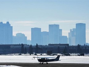 The city skyline shrouded in smog as Alberta Environment warns of poor air quality in Edmonton, March 27, 2013. A temperature inversion is the cause preventing the air from rising and carrying away pollution.