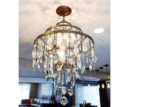 Cutlery adorns this dining room chandelier from Park Lighting.