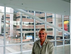 Donna Wilson is a nursing professor at the University of Alberta. Behind her is the University of Alberta Hospital.