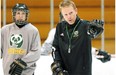 University of Alberta Pandas' head coach Howie Draper (right) gives instruction during team practice at Clare Drake Arena on January 28, 2014.