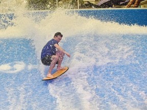Lifeguard Logan Hutchison on West Edmonton Mall's newest ride, the Tsunami, a flow rider where you can ride bodyboards or stand-up flow boards on a continuous wave at the Waterpark in Edmonton, January 29, 2015.