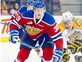 Edmonton Oil Kings forward Brett Pollock, left, and Brandon Wheat Kings centre Jayce Hawryluk chase the puck during WHL action at Rexall Place in Edmonton on Oct. 13, 2014.