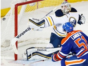 Edmonton Oilers centre Anton Lander scores the game winning goal on Buffalo Sabres goalie Jhonas Enroth during third period NHL action on Jan. 29, 2015, at Rexall Place in Edmonton.