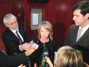 Elise Stolte, Edmonton Journal Alberta Municipal Affairs Minister Diana McQueen speaks to the media about budget cuts with Edmonton Mayor Don Iveson Friday morning at Sutton Place Hotel.