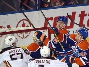 Everyone looks up for the puck during a National Hockey League game between the Edmonton Oilers and Anaheim Ducks at Rexall Place on Feb. 21, 2015.