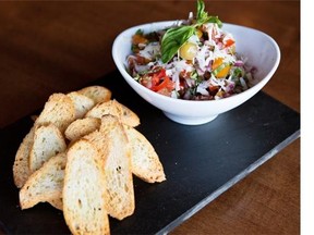 Fragrant and fresh, roasted garlic bruschetta is part of chefs Sarah Masters-Phillips and Matt Phillips’ three-course Valentine’s Day menu for Edmonton Journal readers.