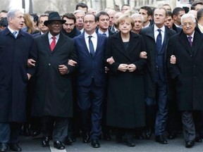 German Chancellor Angela Merkel marches with other world leaders at a rally in Paris on Jan. 11. An ultraorthodox newspaper in Israel removed Merkel from a photo of the event.