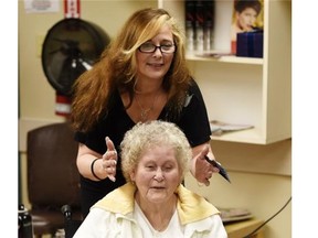 Beth Davidson does Zola Pohl's hair at the salon in St. Michaels Seniors Residence.