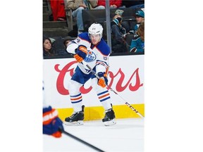 SAN JOSE, CA - DECEMBER 18: Oscar Klefbom #84 of the Edmonton Oilers makes a pass against the San Jose Sharks during an NHL game on December 18, 2014 at SAP Center in San Jose, California. (Photo by Don Smith/NHLI via Getty Images) --- Begin Additional Info --- Oilers ORG XMIT: 507048341