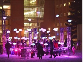 The Lister Light Garden display at celebrations of the University of Alberta Alumni Association’s 100th anniversary the university held the Green & Glow Winterfest in the Quad area in Edmonton, January 30, 2015. A spectacle of light, fire and snow for this special centenary celebration. The old light fixtures are from Lister Hall when they replace them with new ones.