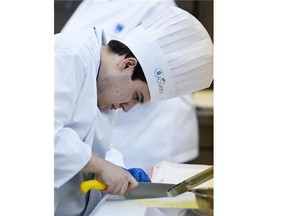 Lucas Istace, a grade 12 student from St. Joe’s H.S., works on ravioli ricotta during the 8th Annual High School Culinary Challenge held at NAIT in Edmonton on Saturday Feb. 7, 2015. 17 teams from 16 local area High Schools took part in the event in which they had to prepare a three course meal for six, being judged on preparation, timing, sanitation, presentation and taste. The winners will be announced on March 9th during an awards dinner at the Shaw Conference Centre.