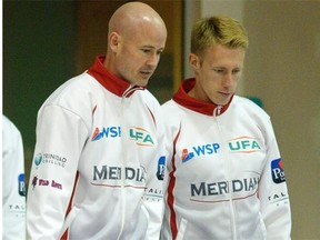 Marc Kennedy, right, discusses strategy with skip Kevin Koe during a practice at the Saville Community Sports Centre on Oct. 9, 2014.