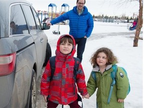 Matt Dance picks up his kids, Joseph, 6, and Mara, 3, from school.