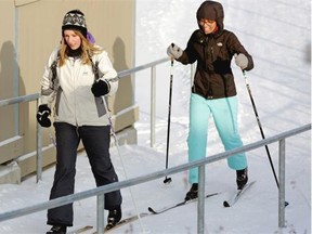 Michelle Jehn, left, and Salma Kaida cross-country ski to the official launch of the Ski2LRT SWAC Rack at the Century Park LRT Station on January 31, 2015. Edmonton has installed a ski rack to encourage people to ski to the public transit station.