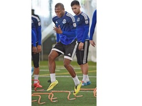 Midfielder Sainey Nyassi works a drill during FC Edmonton’s training camp on Wednesday at the Commonwealth Community Recreation Centre.