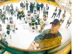 Monday October 6, 2008 Page C4 
 University of Alberta Golden Bears head coach Eric Thurston discusses strategy with his players during a recent practice at Clare Drake Arena on October 1, 2008. Photo by Ryan Jackson/Edmonton Journal