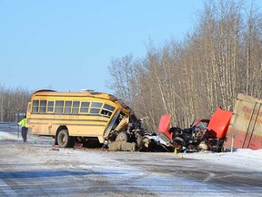 A school bus driver died and 14 students were injured Monday morning when a bus and semi-truck collided north of Grimshaw.