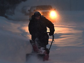 Commuters heading along 106 Avenue near 75 Street in the heavy snowfall hitting Edmonton, February 5, 2015.