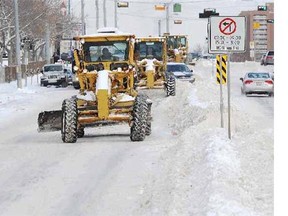 A seasonal parking ban will go into effect late Sunday night so crews can continue to clean up an unexpected snowfall from Saturday.